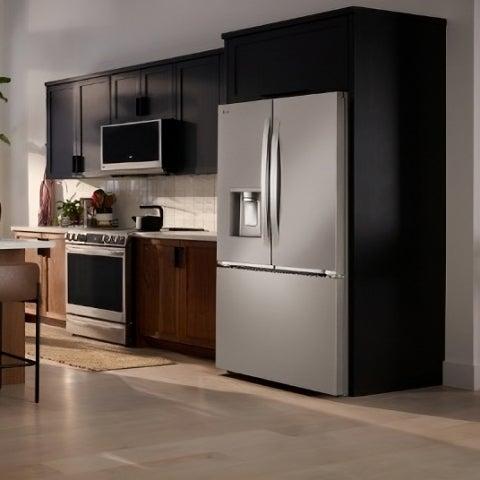 Modern kitchen with stainless steel refrigerator, microwave, and stove in a sleek, minimalist design.